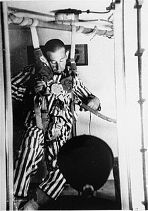 A victim loses consciousness during a depressurization experiment at Dachau by Luftwaffe doctor Sigmund Rascher, 1942.