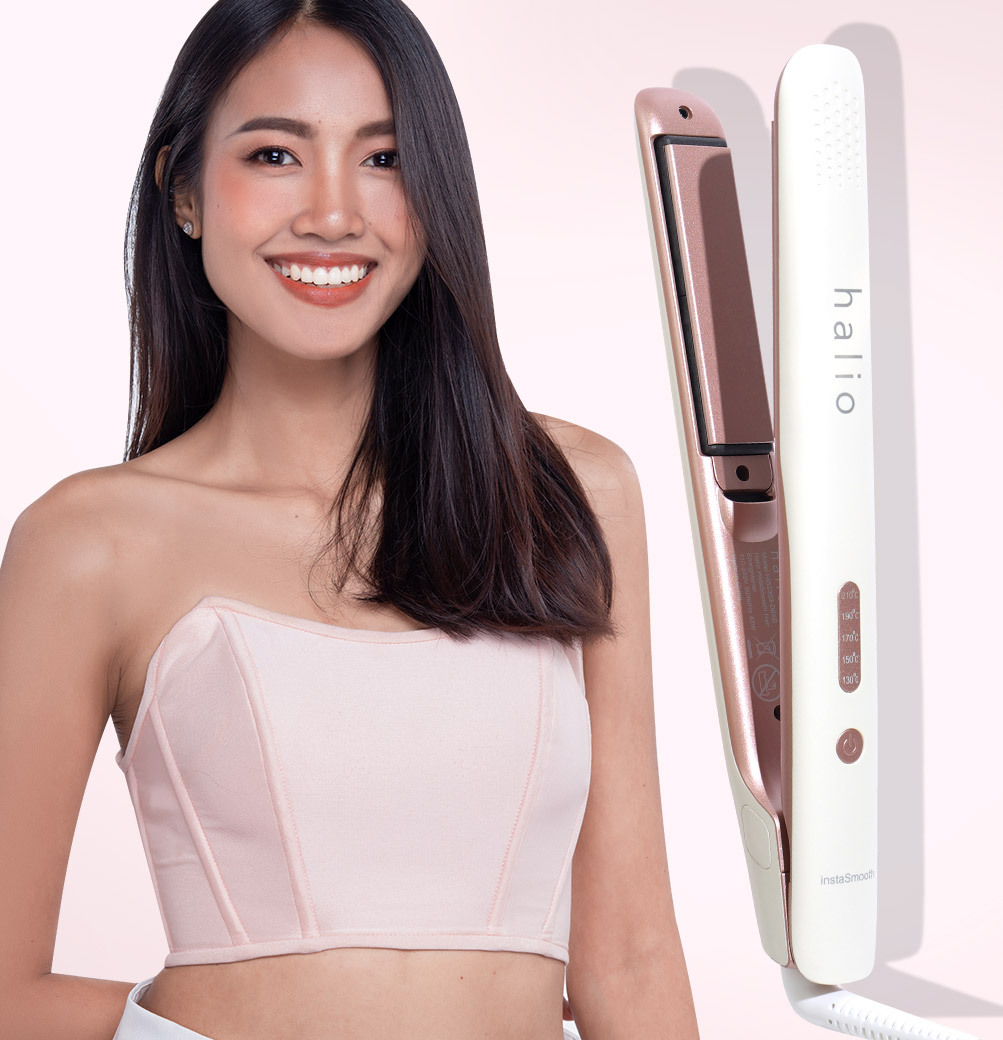 Cô gái trẻ tươi cười khoe mái tóc mượt mà bên cạnh sản phẩm máy duỗi tóc Halio. Bài viết khám phá lý do bạn không nên bỏ qua cơ hội săn quà GWP 3 triệu từ Lixibox, cùng tìm hiểu GWP là gì và lý do nên săn GWP Lixibox.