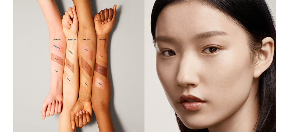 Bốn cánh tay thể hiện các tông màu kem nền Fenty Beauty từ Light 100 đến Deep 400, phù hợp cho việc trang điểm và tạo lớp nền hoàn hảo. Những tông màu này minh họa cách trang điểm trẻ hơn tuổi và xu hướng son mới, tạo nguồn cảm hứng cho nhiều người yêu thích làm đẹp.