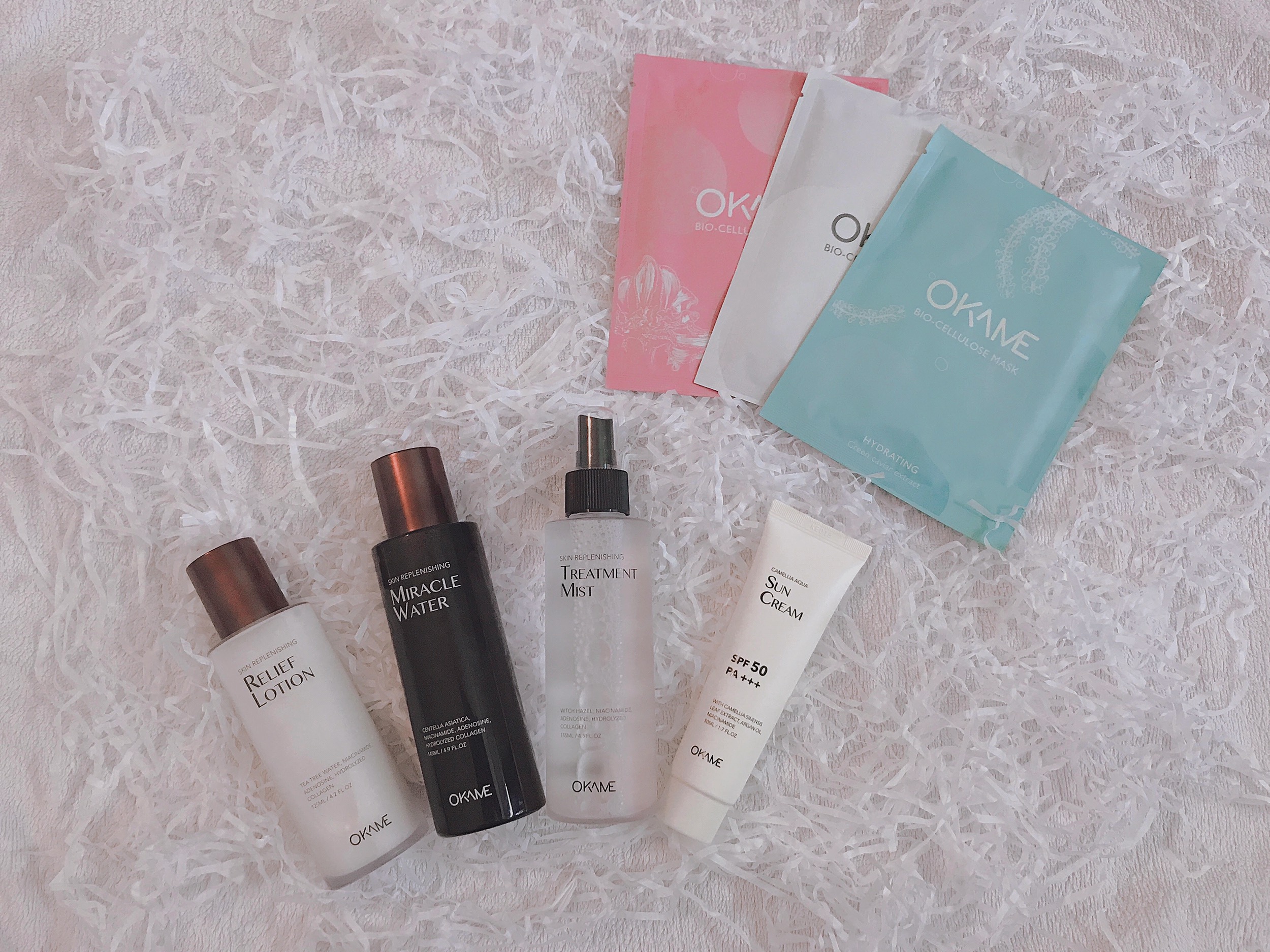 Bộ sản phẩm chăm sóc da OKAME gồm mặt nạ Hydrating, Anti-aging và Brightening cùng các sản phẩm dưỡng da như Relief Lotion, Miracle Water và Treatment Mist, mang đến quy trình dưỡng da cơ bản hiệu quả.