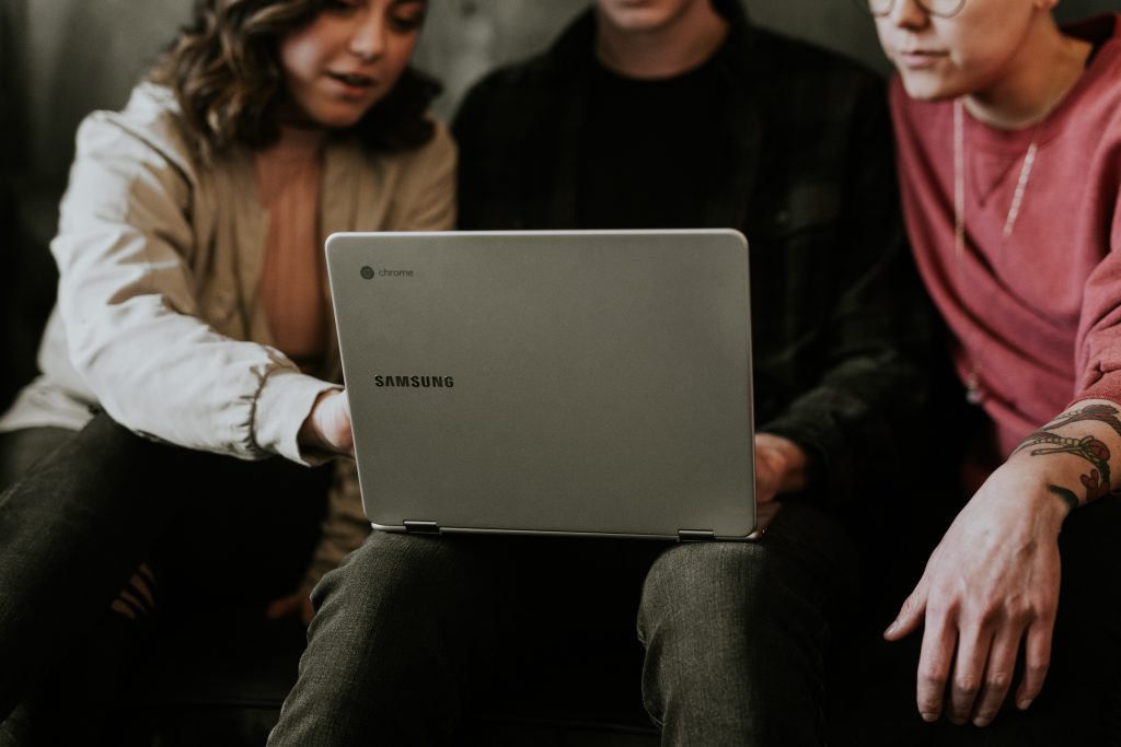 Online to offline - Community, people around a chromebook
