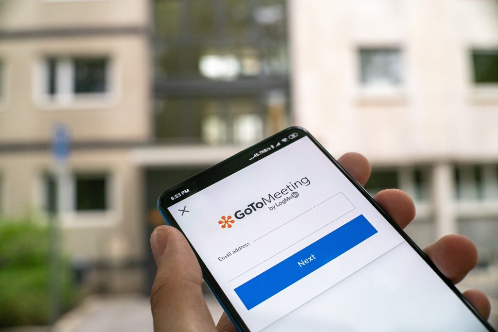 CX strategy image, phone logging into a remote meeting.