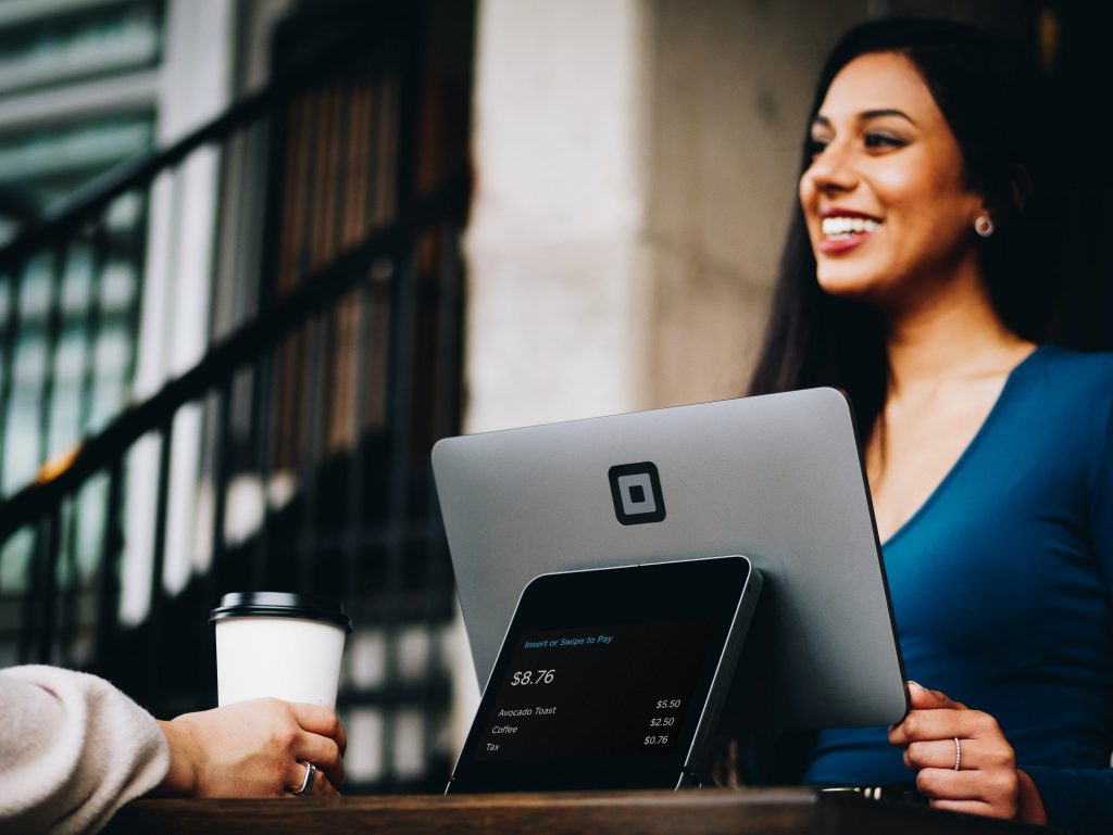 Customer Experience Strategies in 2021 - customer service in a store with a counter