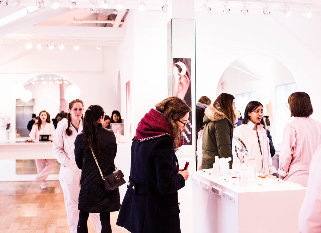 Customer Experience Strategies in 2021 - customers walking around a showroom.