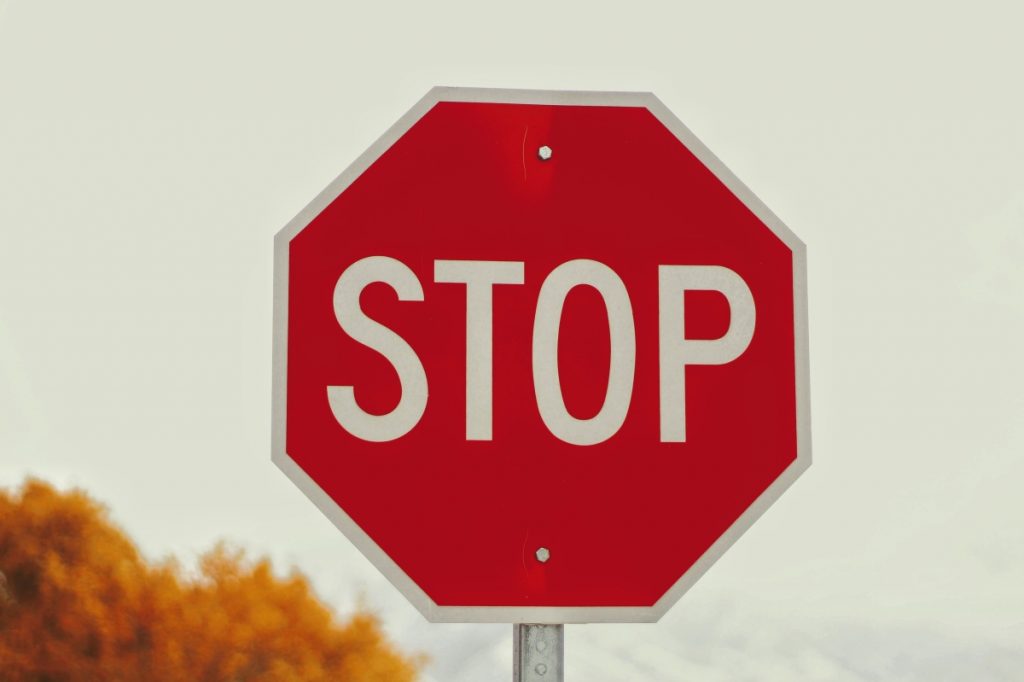 Stop sign illustrating barriers put in front of users