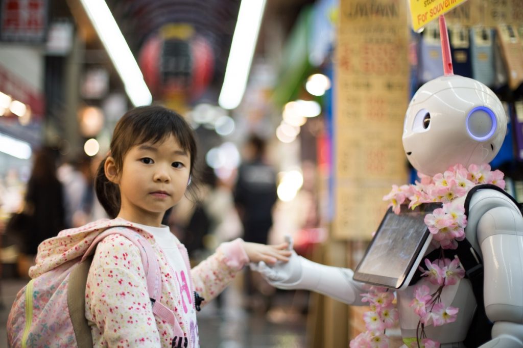 Paid search trends 2022 - image of a child with a robot.