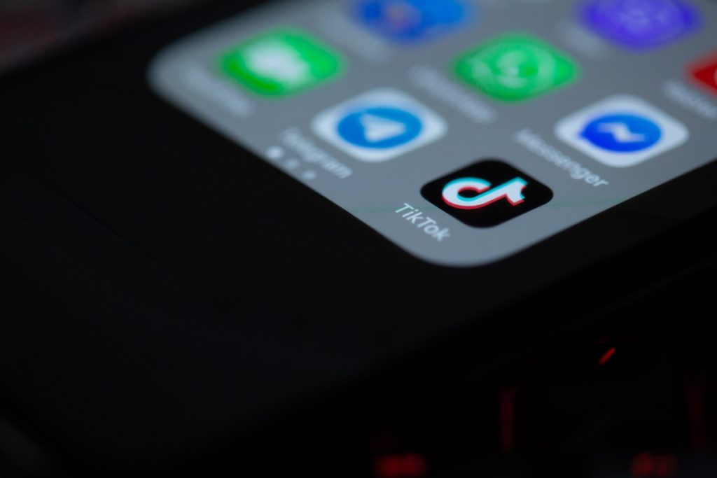 Paid search trends 2022 - Image of an iphone with the tiktok app icon.