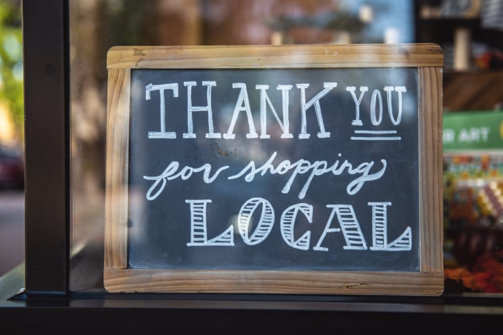 2022 paid search trends - Sign saying thank you for shopping local.