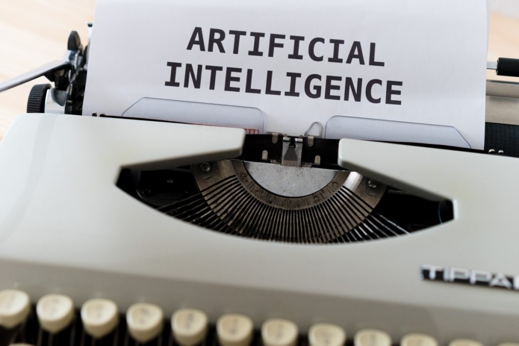 Digital Transformation 2022 - Image of a typewriter with artificial intelligence written on paper.