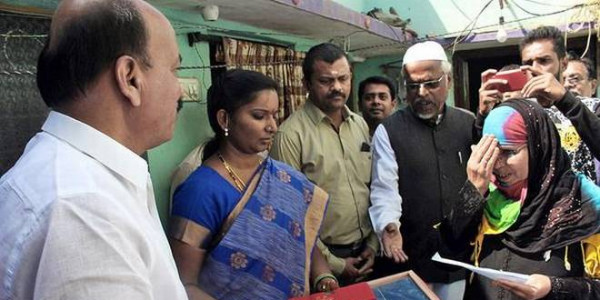 Beneficiaries receive cheques from MLA at their doorstep