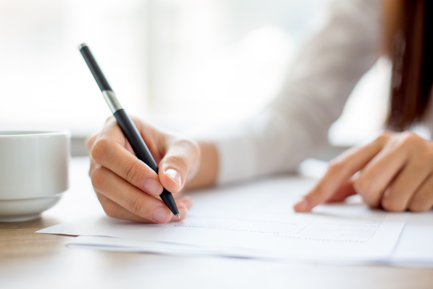 Editors%2 Fimages%2 F1647490073318 Hand Businesswoman Writing Paper Office