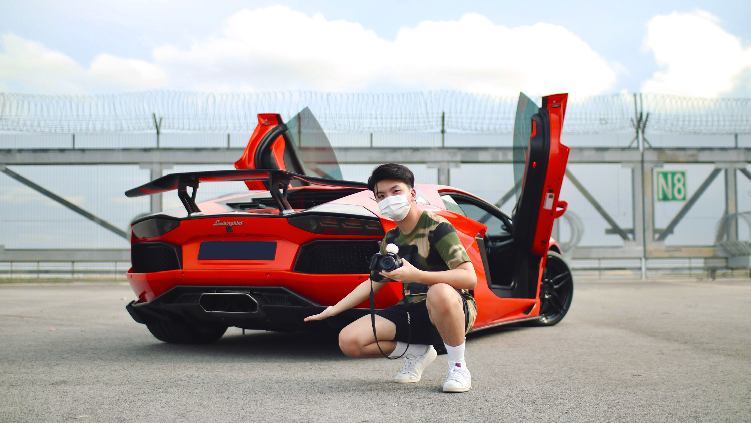 Editors%2 Fimages%2 F1647571785063 Standing+Beside+Car