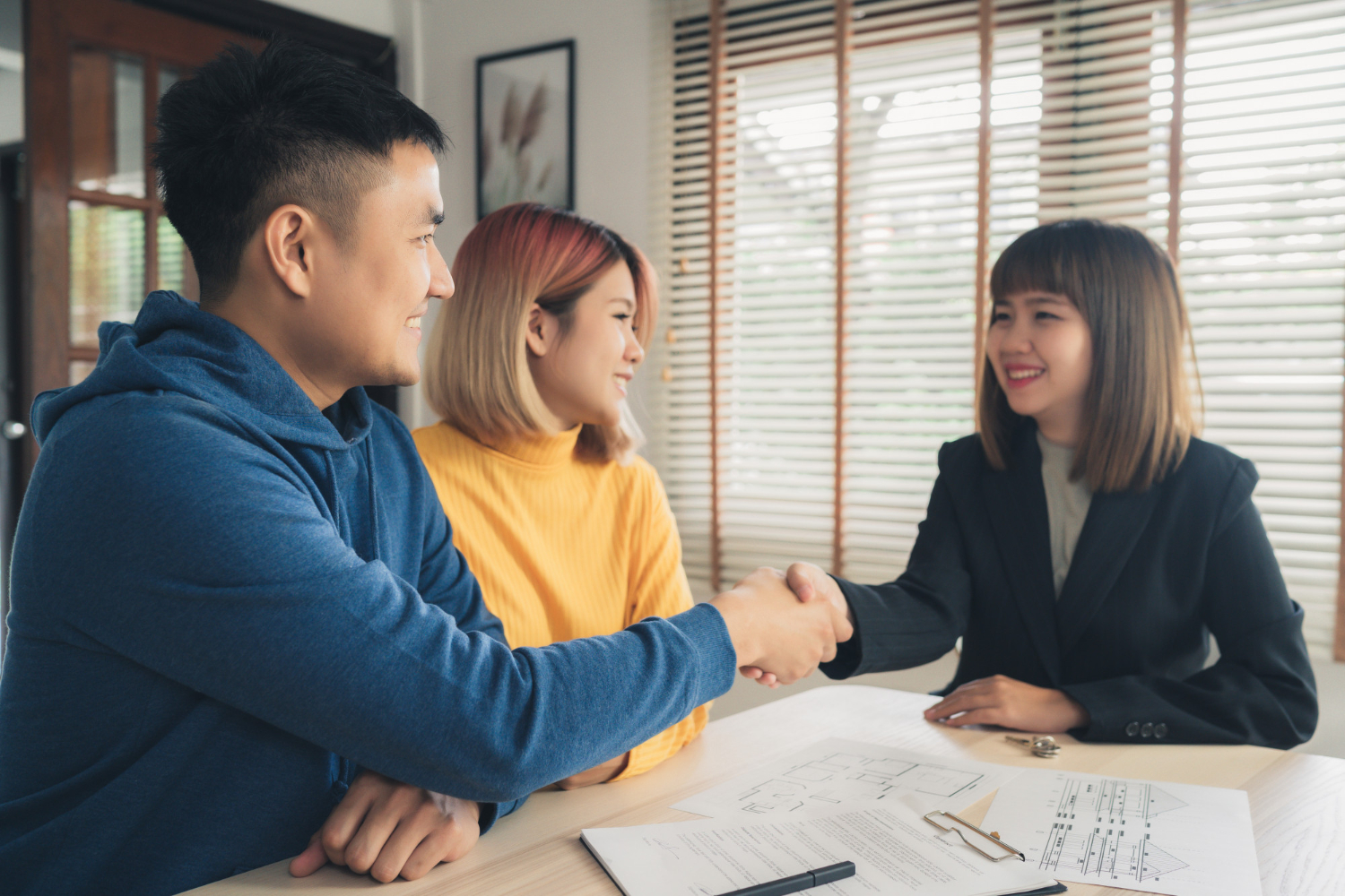 Editors%2 Fimages%2 F1648182698136 Happy Young Asian Couple Realtor Agent