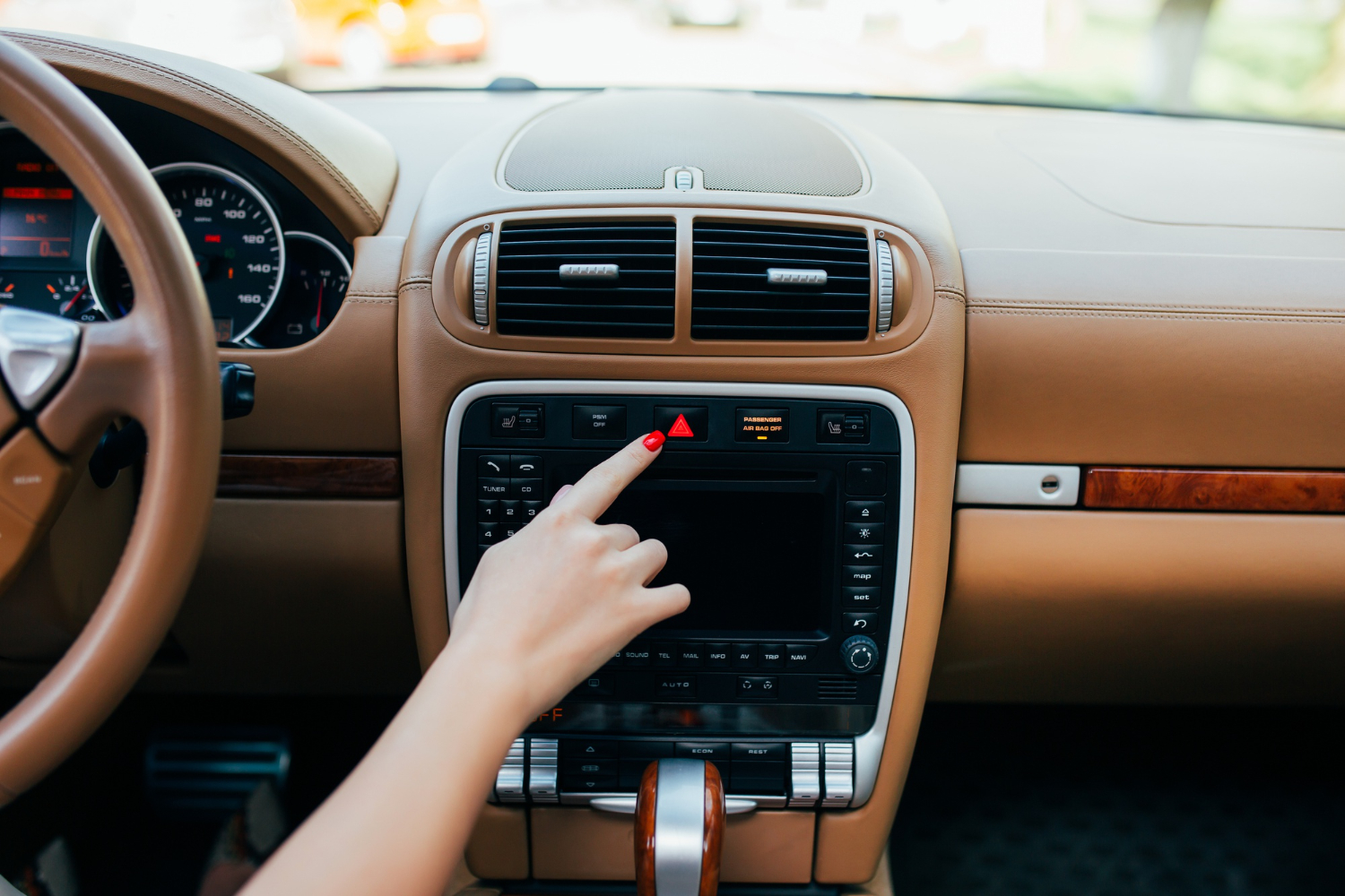 Editors%2 Fimages%2 F1660538220976 Car Dashboard Radio Closeup Woman Sets Up Radio