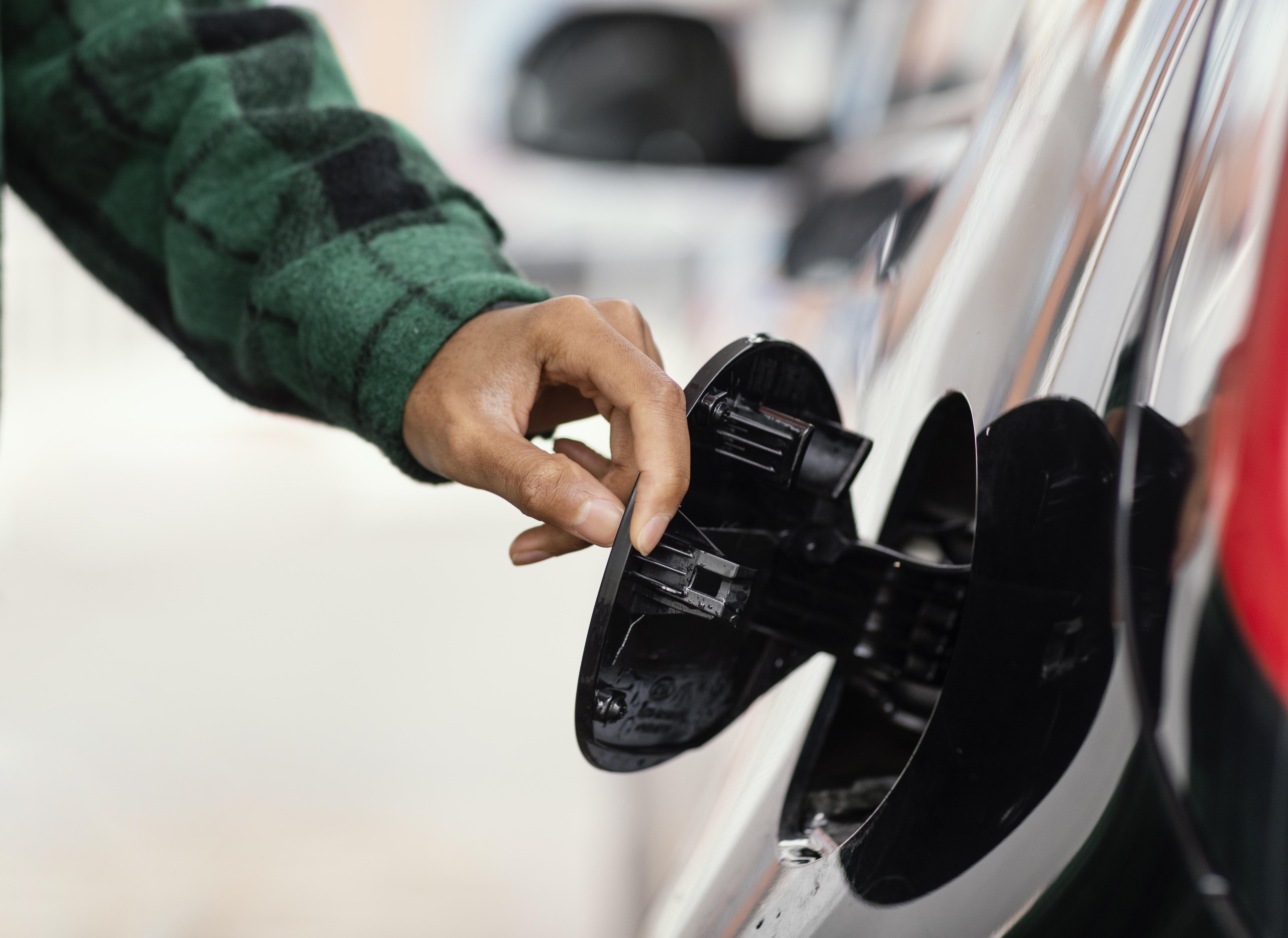 Editors%2 Fimages%2 F1708660580571 Man Gas Station With Car