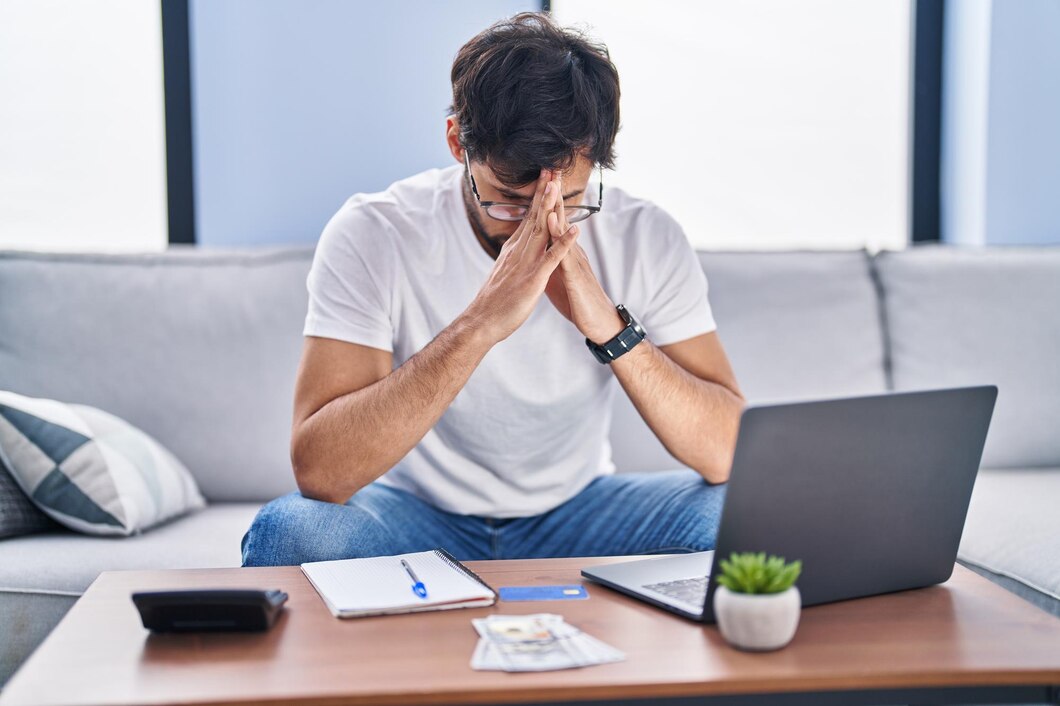 Editors%2 Fimages%2 F1716954445030 Young Hispanic Man Stressed Using Laptop Working Home 839833 1671