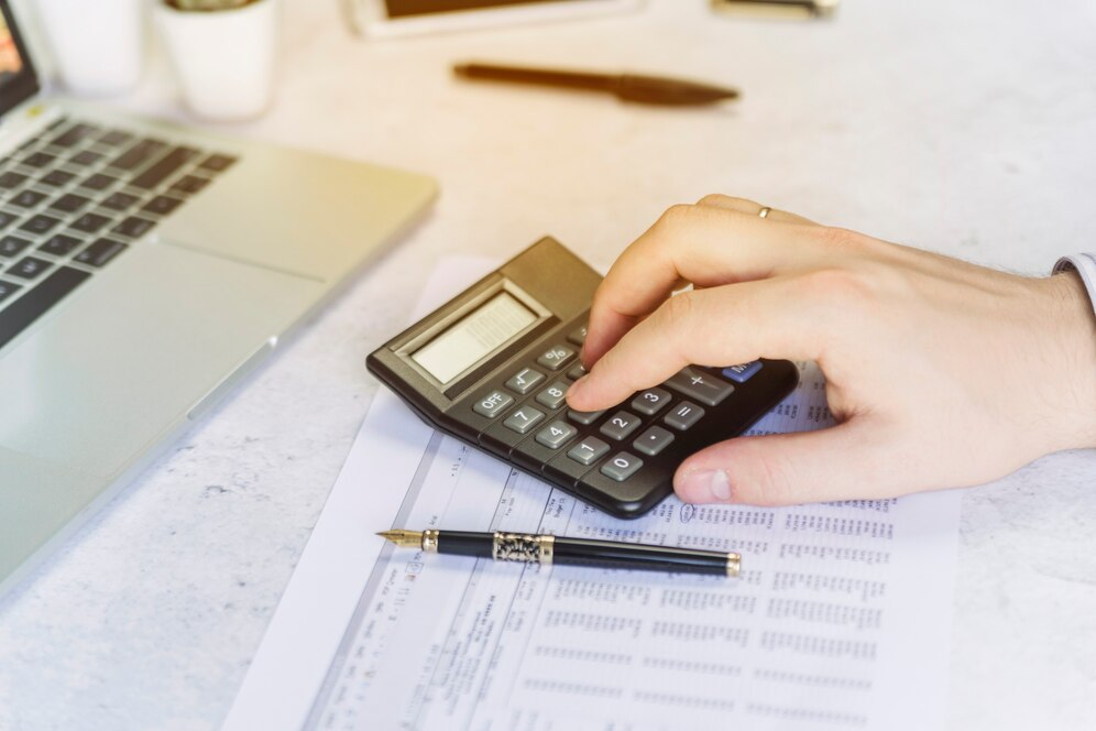 Editors%2 Fimages%2 F1737000547321 Man Hand Counting Calculator 23 2147965768