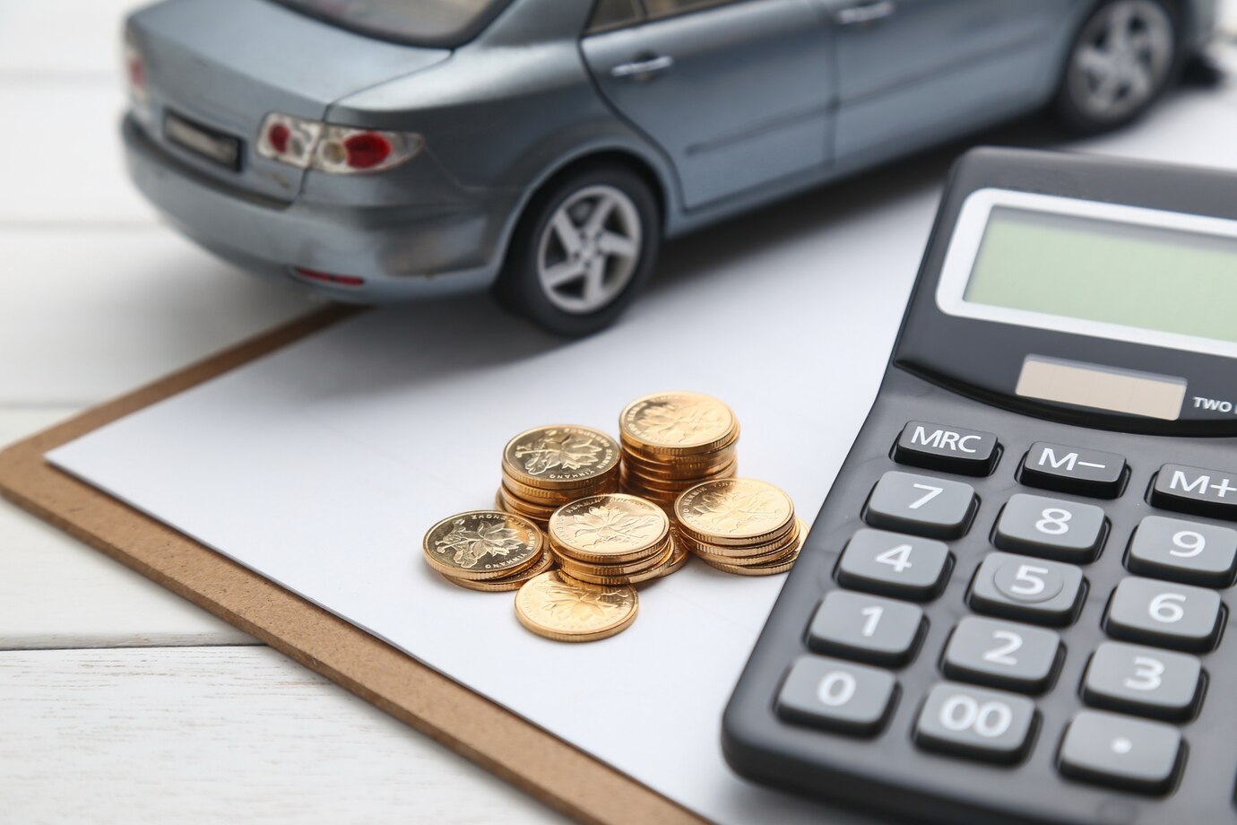 Editors%2 Fimages%2 F1741587863180 Car Model Calculator Coins White Table 1387 583