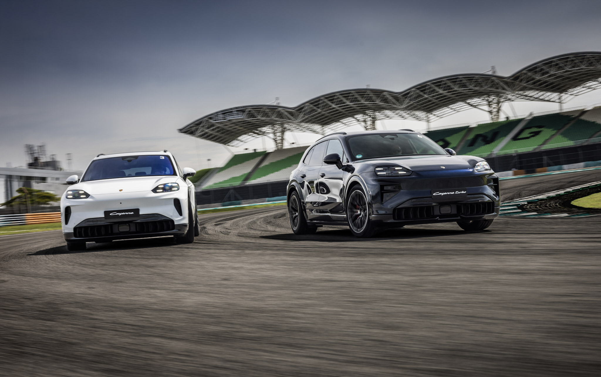 Porsche Cayenne and Cayenne Turbo on a racetrack