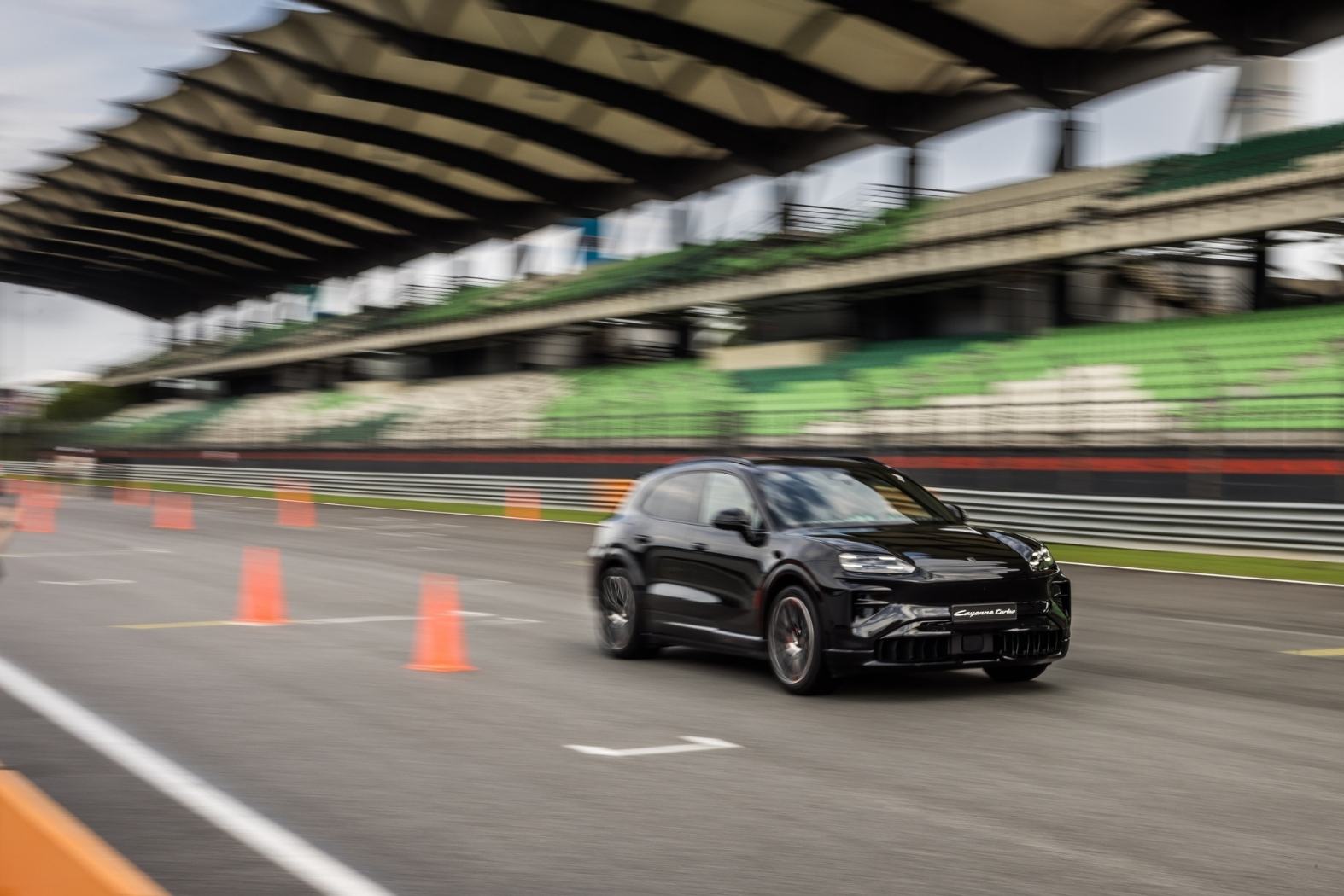 The Porsche Cayenne Electric sprinting on race track