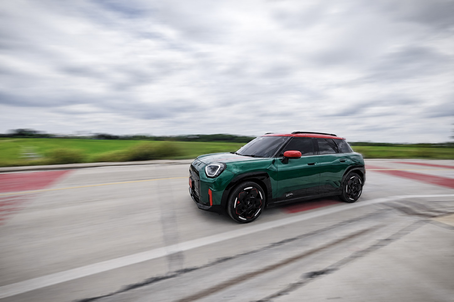 The Mini Aceman JCW driving around the corner