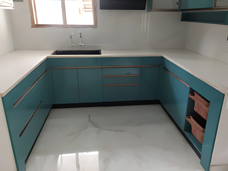 Custom L-shaped modular kitchen with matte finish storage units