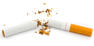 A cigarette breaking symbolizing the end of addiction.