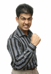 A man pumping his fist in victory and determination