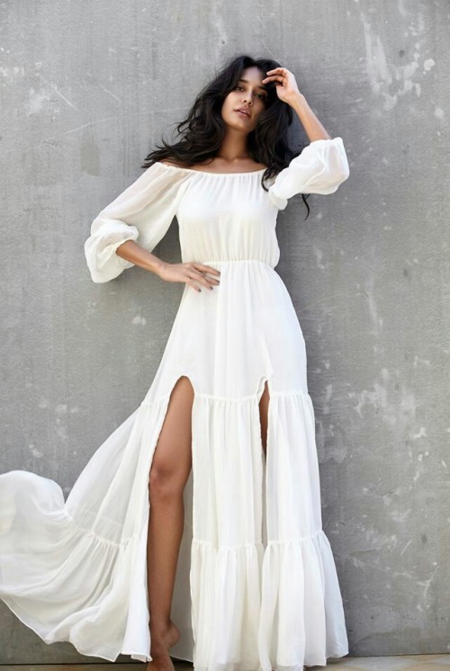 Looking for this white off shoulder slit maxi dress that Lisa Haydon is wearing - SeenIt