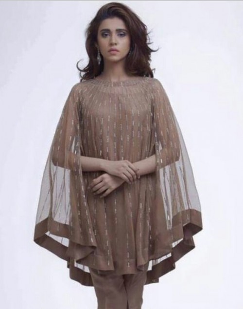 Find me a similar long cape top. - SeenIt