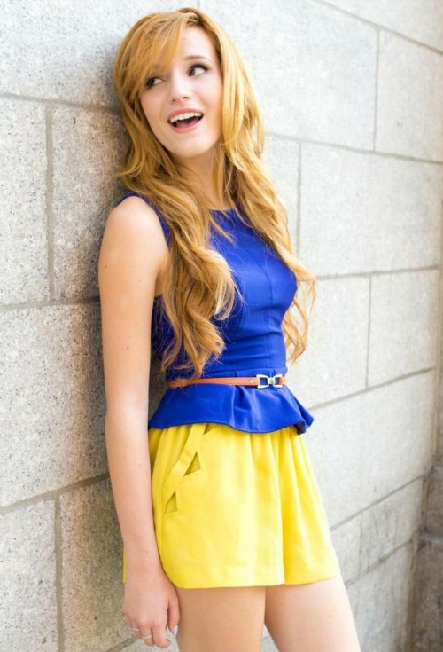 Help me find a similar blue peplum top and yellow shorts as Bella Thorne is wearing - SeenIt