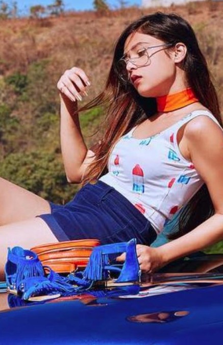 I'm looking for a similar printed white top and blue shorts as seen on caughtinacuff - SeenIt