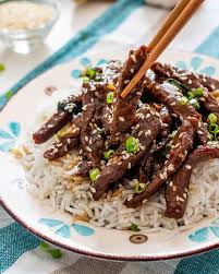 Sizzling Beef Served with Rice and Salad