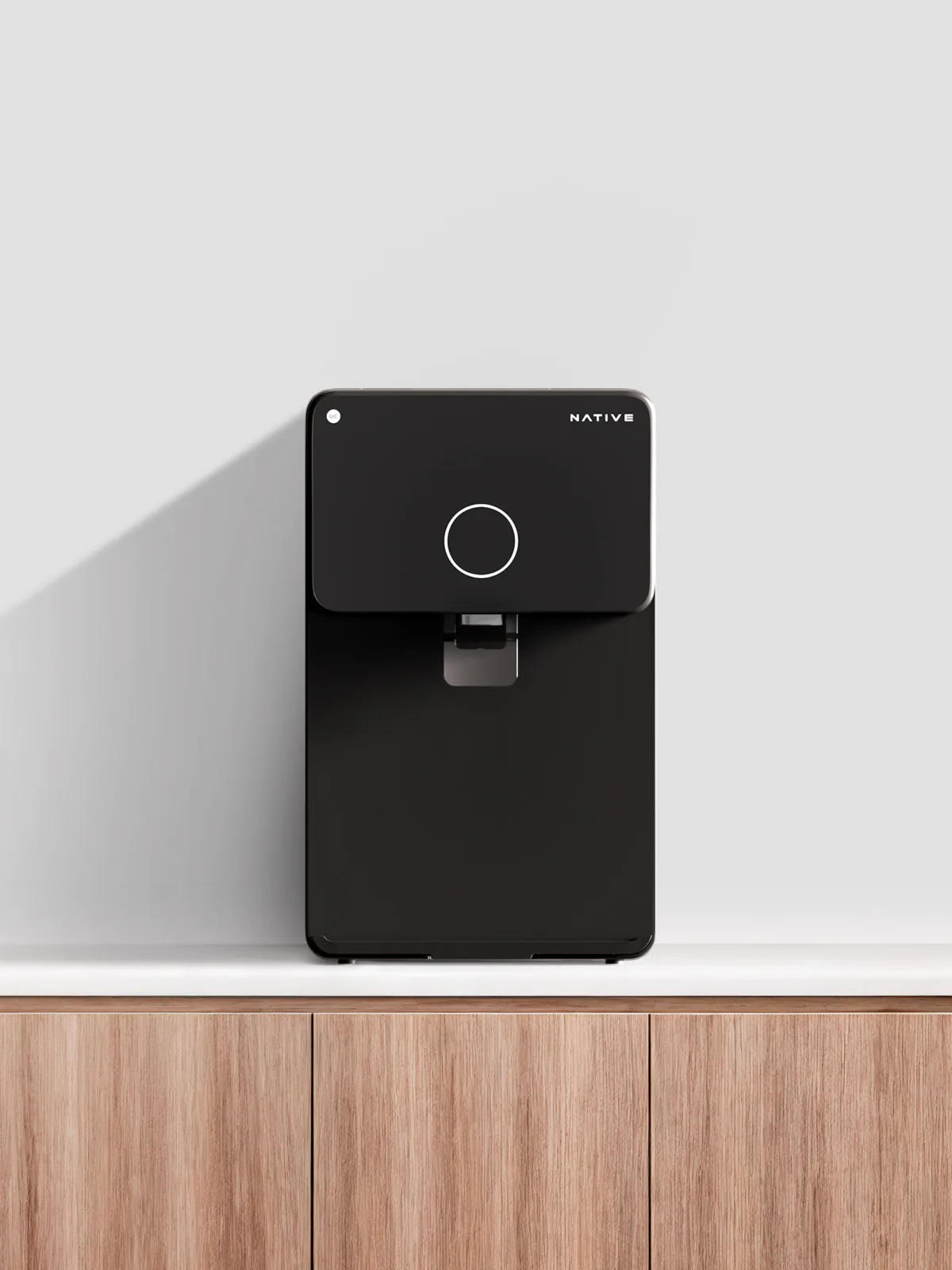 Native M1 Pro standing on a wooden kitchen counter.