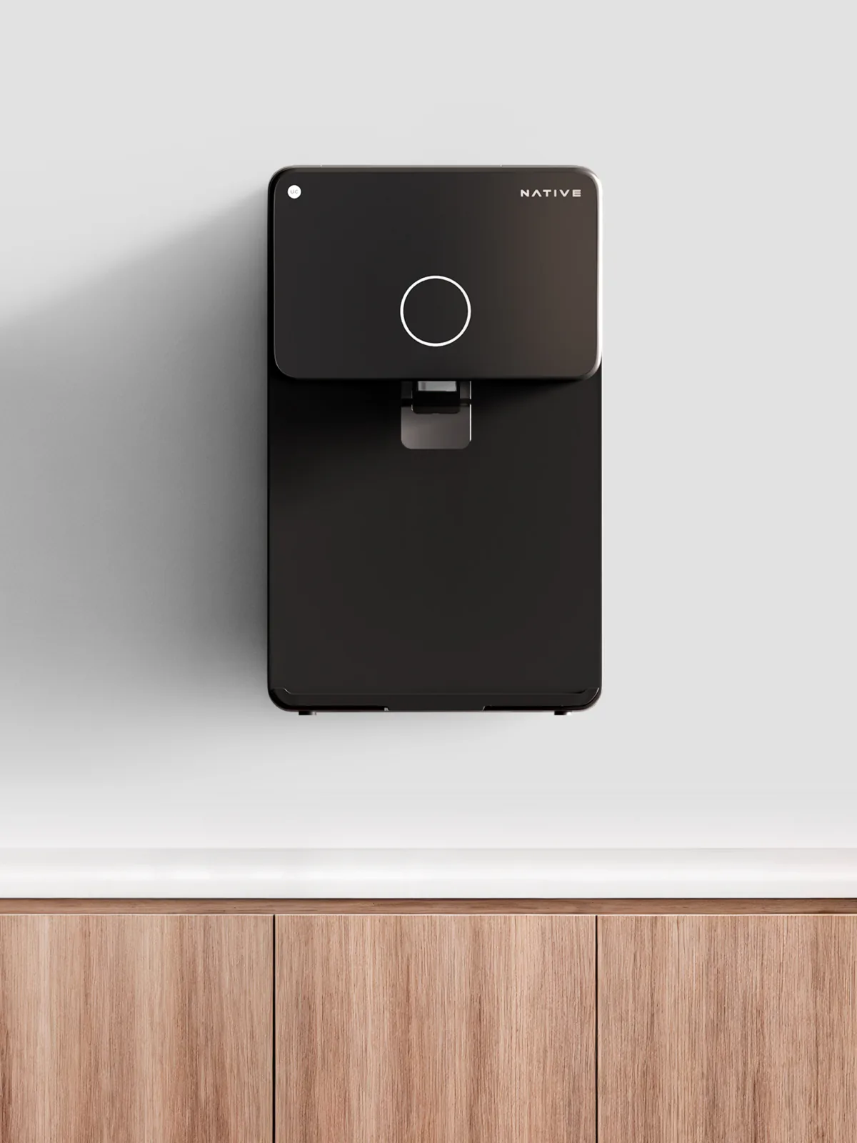 Native M1 Pro mounted on a white kitchen wall.