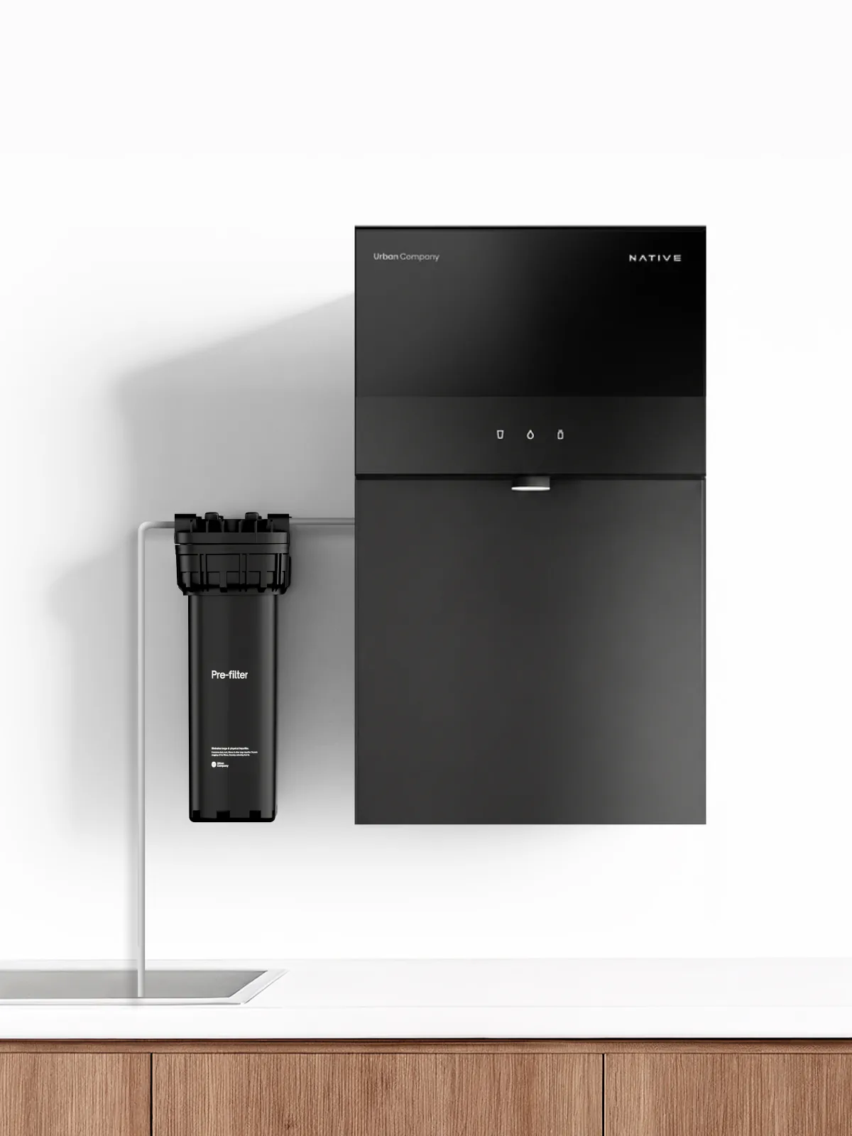 Wall-mounted Native M3 beside a pre-filter joined by a thin inlet pipe.