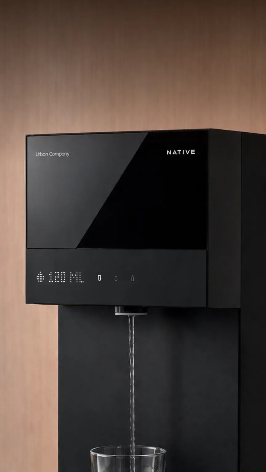 Native M3 Pro on a wooden wall, the display counting 120 ML as water pours into a glass.