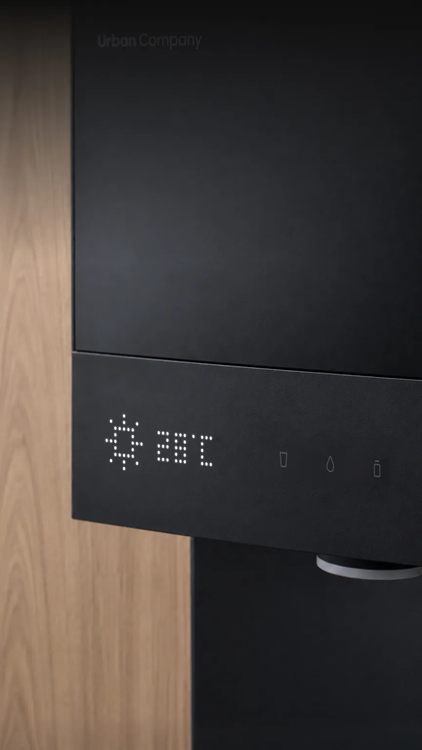 Native M3 Pro on a wooden wall, its dot-matrix display showing the weather: sunny, 28 °C.