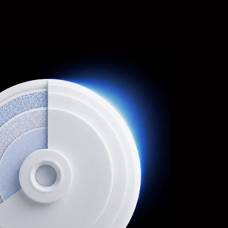 Larger MultiMicron™ filter disc from the Native M3 Pro in cross-section, showing its layered filter media lit in blue.