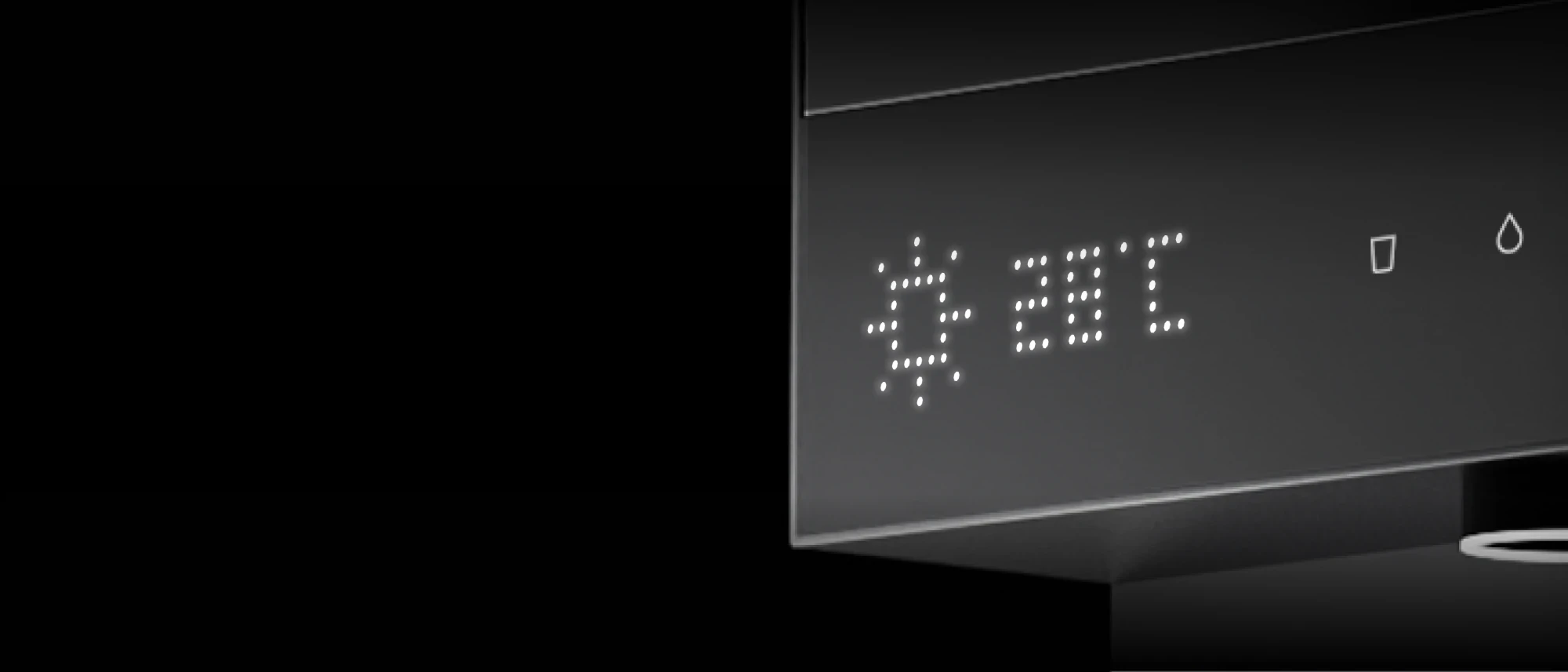 Close-up of the Native M3 Pro's dot-matrix display showing a sun icon and 28 °C, beside the glass and water-drop touch icons.