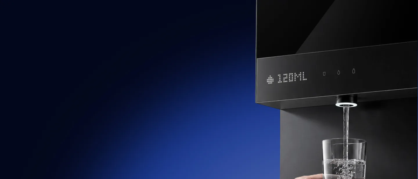 A hand fills a glass from the Native M3 Pro spout as its dot-matrix display counts 120 ML, against a deep blue gradient.