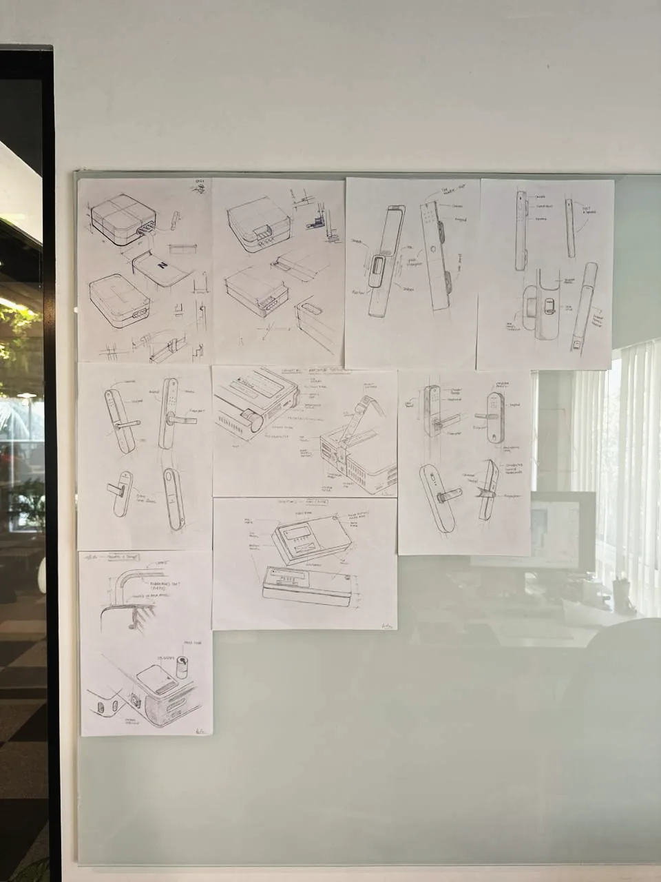Pencil sketches pinned to the lab wall