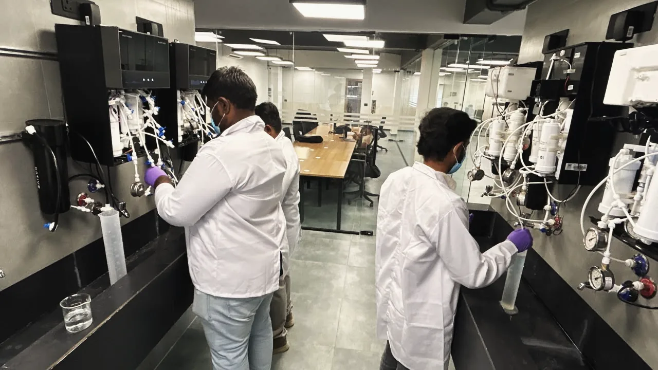 Engineers testing purifiers on the lab rig