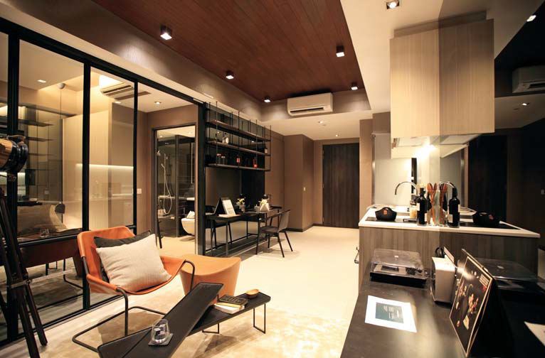 Showflat of a one-bedroom unit at Gem Residences. The fully fitted unit comes with Smeg appliances such as oven, refrigerator and washer-dryer.