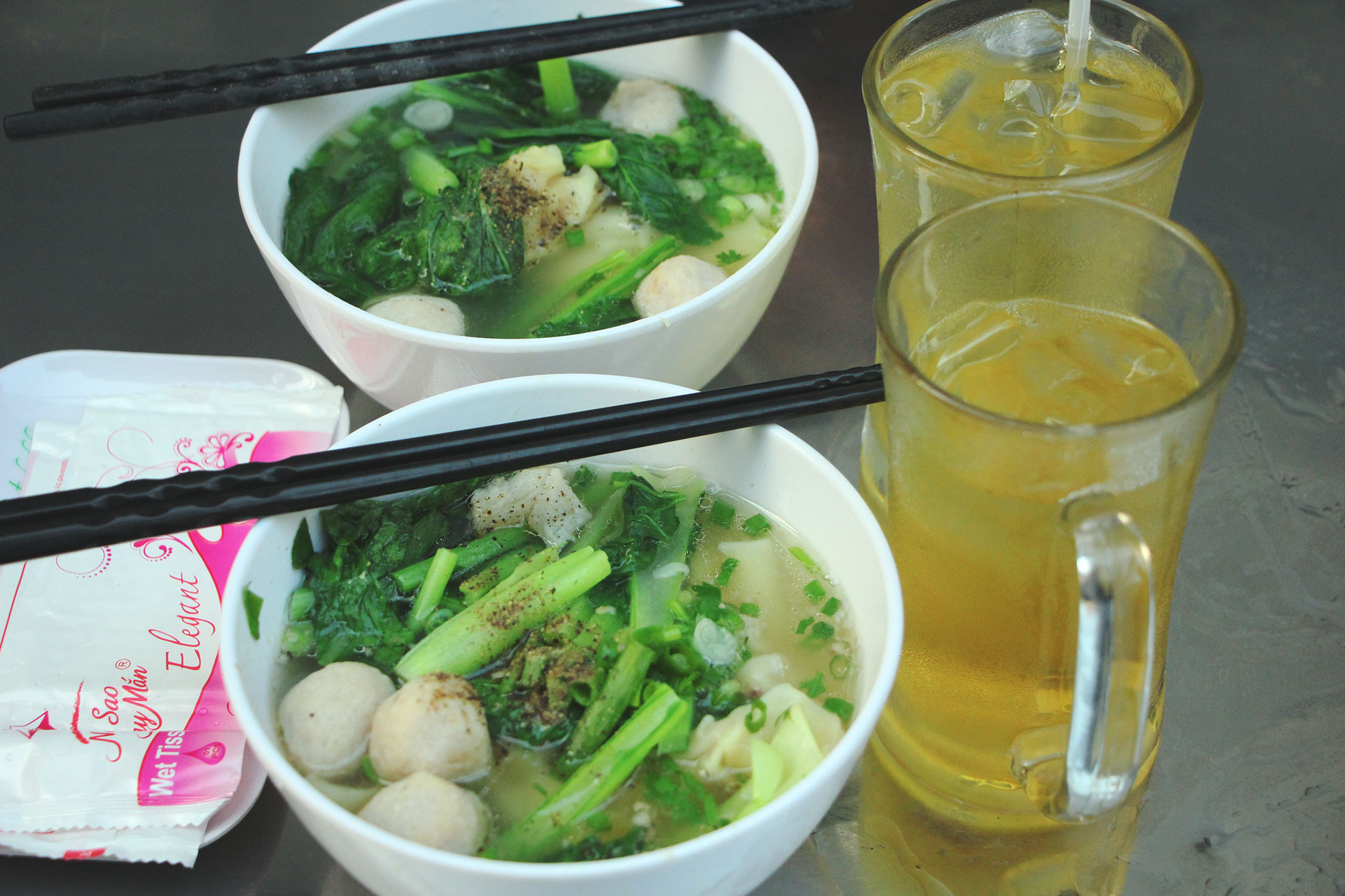 Noodles with meatballs and dumplings, with cool and refreshing iced-tea to start your day